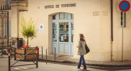 NOIRMOUTIER, FRANCE - July 03, 2017 : woman walks in front of the tourist information office in downtown Noirmoutier, Franceのeditorial素材