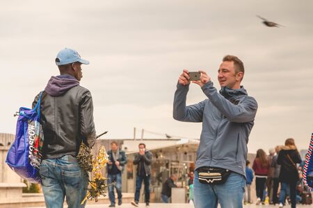 PARIS, FRANCE - May 08, 2017 : on the Place du Trocadero, street vendors offer souvenirs and key...