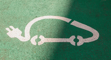 close-up on a logo of parking for electric car on green backgroundの写真素材