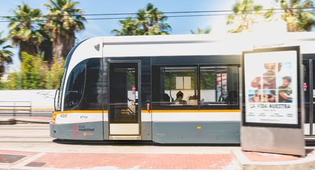 VANLENCIA, SPAIN - june 16, 2017: Metrovalencia tram, a public transport system created in 1988, traveling near the University of Valancia, Spainのeditorial素材