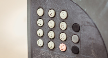 old worn out and dirty keypad on a street parking machineの写真素材