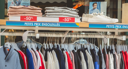 NOIRMOUTIER, FRANCE - July 03, 2017 : Showcase of a clothing store during the Summer SOLDES 2017, a national operation that allows traders to empty their stock before winterのeditorial素材