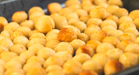 close up fried mashed potato balls in a frying panの写真素材