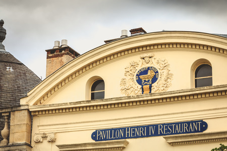 SAINT GERMAIN EN LAYE, FRANCE - July 12, 2017 : In the garden of the castle of Saint Germain en Laye, the Henry IV Pavilion where the French King Louis XIV was born on 5 September 1638. The building has now become a restaurantのeditorial素材