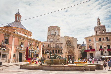 VALENCIA, SPAIN - June 16, 2017 : street atmosphere on the square of the virgin where tourists walk in front of the Basilica of the Virgin and the Cathedral of St. Mary of Valenciaのeditorial素材