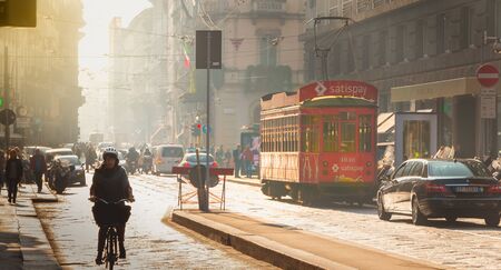 MILAN, ITALY - November 03, 2017 : street atmosphere in the city of Milan with its tourists, cars...