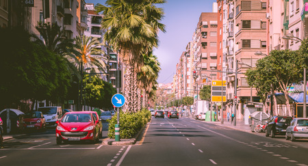 VALENCIA, SPAIN - June 18, 2017 : Traffic atmosphere at a junction on a city boulevard at a time with little car and no traffic jamのeditorial素材