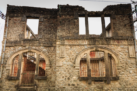 ORADOUR SUR GLANE, FRANCE - December 03, 2017 : remains of the village post office in ruins following the massacre of the population by the German army on June 10, 1944のeditorial素材