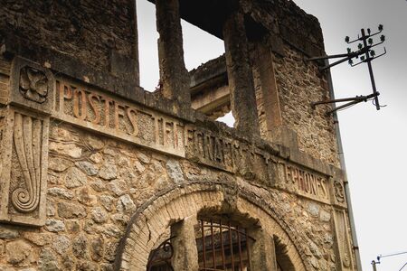 ORADOUR SUR GLANE, FRANCE - December 03, 2017 : remains of the village post office in ruins following the massacre of the population by the German army on June 10, 1944のeditorial素材