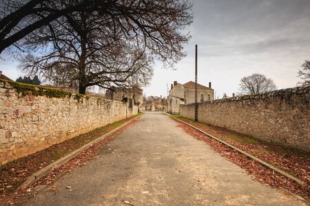 ORADOUR SUR GLANE, FRANCE - December 03, 2017 : in the village streets, remains in ruins of houses destroyed by fires during the massacre of the population by the German army at the end of World War IIのeditorial素材