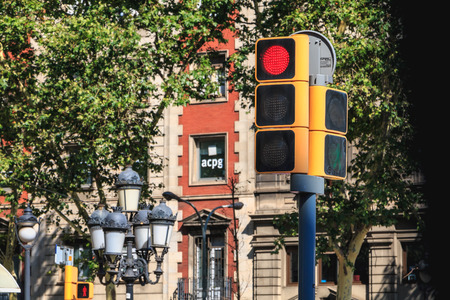BARCELONA, SPAIN - June 20, 2017 : traffic light in a city street which prohibits the passage of vehicles at a crossroads on a summer dayのeditorial素材