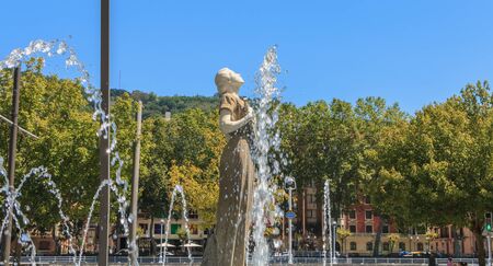 Bilbao, Spain - July 19, 2016 : statue of Melpomene, in Greek mythology the muse of singing, carved by Enrique Barros, under the sun on a summer dayのeditorial素材