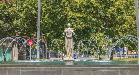 Bilbao, Spain - July 19, 2016 : statue of Melpomene, in Greek mythology the muse of singing, carved by Enrique Barros, under the sun on a summer dayのeditorial素材