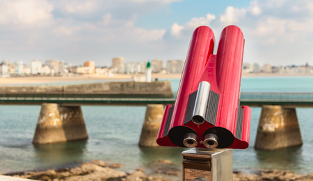 Sables d Olonne, France - October 13, 2015 : binocular telescope for tourist pointed to the beach on a fall dayのeditorial素材