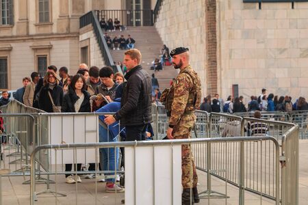 Milan, Italy - November 02, 2017 : soldiers monitor and control tourists at the entrance of Milan Cathedral on a fall dayのeditorial素材