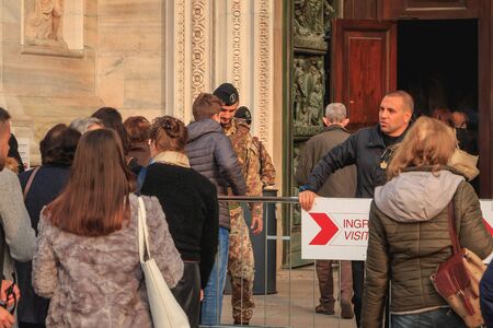 Milan, Italy - November 02, 2017 : soldiers monitor and control tourists at the entrance of Milan...