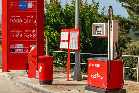 Huesca, Spain - June 21, 2017 : detail of a CEPSA gas station on a small country road with its price panels and fuel pumps at the end of the dayのeditorial素材