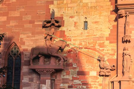 architectural detail of the protestant cathedral of Basel in Switzerland known as the emblem of the cityの写真素材