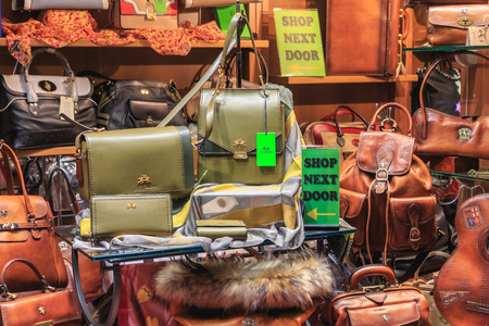 Bellagio, Italy - November 04, 2017 : example of a well-known night and autumn store showcase that sells Italian women bags and accessoriesのeditorial素材