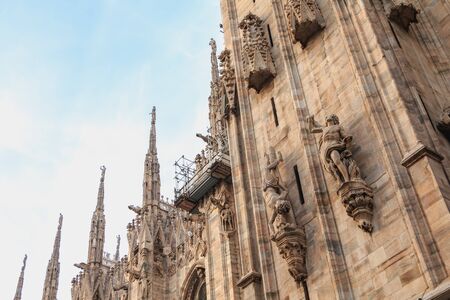 exterior sculpture detail of the facade of the Cathedral of the Nativity of the Blessed Virgin of Milan, Piazza del Duomo, Italyの写真素材