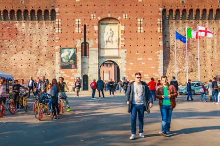 Milan, Italy - November 03, 2017: tourists walk in front of the Castle of Sforza on a fall day, a fortress built in the fifteenth century by Francesco Sforza, Duke of Milanのeditorial素材
