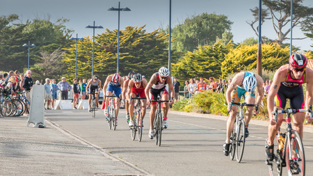 Saint Gilles Croix de Vie, France - September 10, 2016 : Final triathlon championship of France in the category D3 - cyclists straight for a road bike raceのeditorial素材