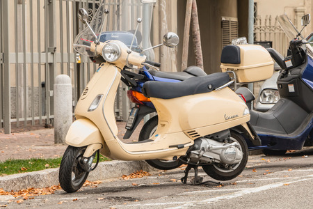 Como, Italy - November 4, 2017: A typical Italian Vespa scooter parked in a street in the city center on a fall dayのeditorial素材