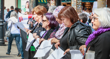 Toledo, Spain - April 28, 2018: in the central square of the city on a spring day, peaceful demonstration of activists Mujeres de Negro (women in black) against the war in Israelのeditorial素材
