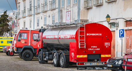 Faro, Portugal - May 01, 2018: Fire trucks parked in front of a volunteer fire station on a spring...