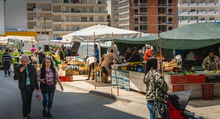 Quarteira, Portugal - May 2, 2018: Small outdoor market where local producers sell their goods on a spring dayのeditorial素材