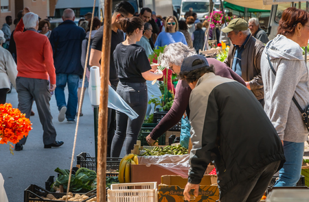 Quarteira, Portugal - May 2, 2018: Small outdoor market where local producers sell their goods on a spring dayのeditorial素材