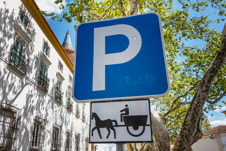 blue road sign indicating parking for a hitch horses in Evora, Portugalの写真素材