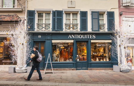 Mulhouse, France - December 23, 2017: street atmosphere on a winter day where people walk in a pedestrian street with typical buildingsのeditorial素材