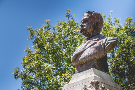 Evora, Portugal - May 5, 2018: View of a public garden on a spring day with a statue of Francisco Eduardo de Barahona Fragoso sculpted by the Portuguese Jose Simoes de Almeidaのeditorial素材