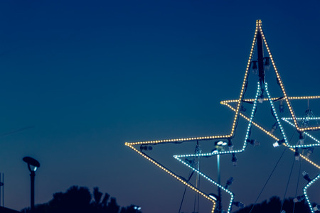 christmas star in led light on night backgroundの写真素材