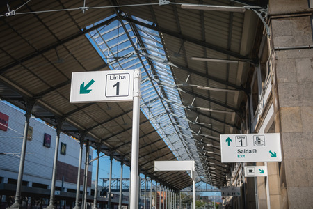Viana do Castelo, Portugal - May 10, 2018: sign indicating the exit and line 1 in the train station on a spring dayのeditorial素材