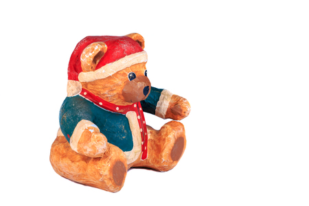 little bear dressed for christmas on a white background in studioの写真素材