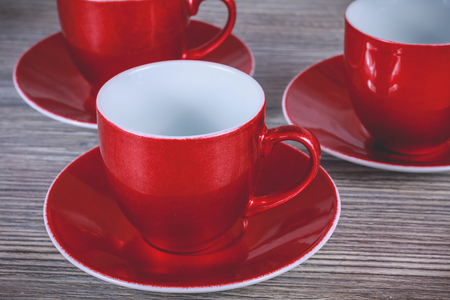 three red christmas mug on gray wooden background in studioの写真素材