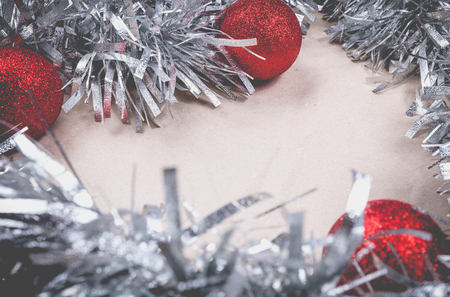 happy christmas concept with grey decoration on old wooden board and writing space on paperの写真素材