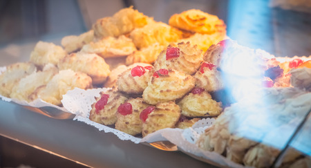 appetizing Portuguese pastries on display in the window of a pastry shopの写真素材
