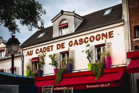 Paris, France - October 6, 2018: front of the restaurant Au Cadet de Gascogne on the Place du Tertre in the famous district of Montmartre on a fall dayのeditorial素材