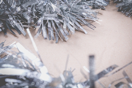 happy christmas concept with grey decoration on old wooden board and writing space on paperの写真素材