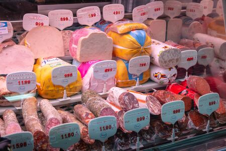 Toledo, Spain - April 27, 2018 - Shop window of appetizing cold cuts and smoked Spanish ham on a spring dayのeditorial素材