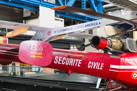 Paris, France - October 6, 2018 - Old Red Helicopter of Civil Security exhibited at the entrance of...