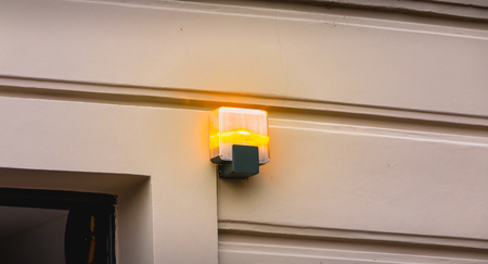 yellow flashing light at the exit of a parking lot in Italy