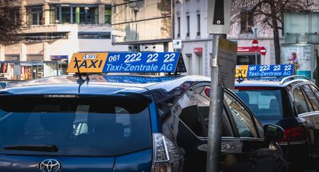 Basel, Switzerland - December 25, 2017: Taxis park in a resort waiting for customers in the city center on a winter dayのeditorial素材