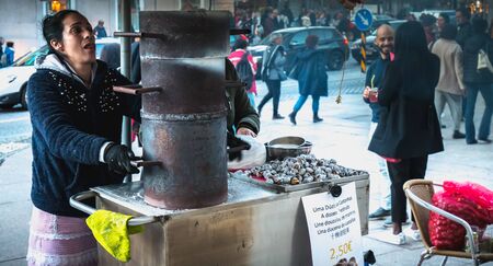 Porto, Portugal - 30 November 2018: Street vendors of roasted chestnuts in front of Sao Bento station in the city center on a fall dayのeditorial素材