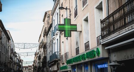 Sete, France - January 4, 2019: People walking in a shopping street in the historic city center on a winter dayのeditorial素材