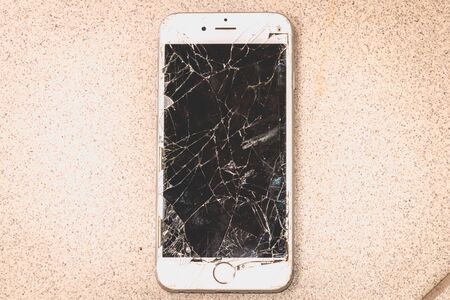 Paris, FRANCE - August 26, 2017: white iPhone 6S developed by the company Apple Inc., whose screen is broken after a violent fallのeditorial素材