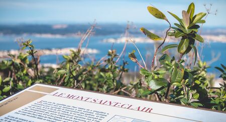 Sete, France - January 4, 2019: tourist plaque telling the story of Mont Saint Clair on the height of the city on a winter dayのeditorial素材